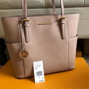 Michael Kors jet set travel.